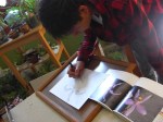 Student drawing orchid using a reference photo. @ Bianaca Ana Chavez